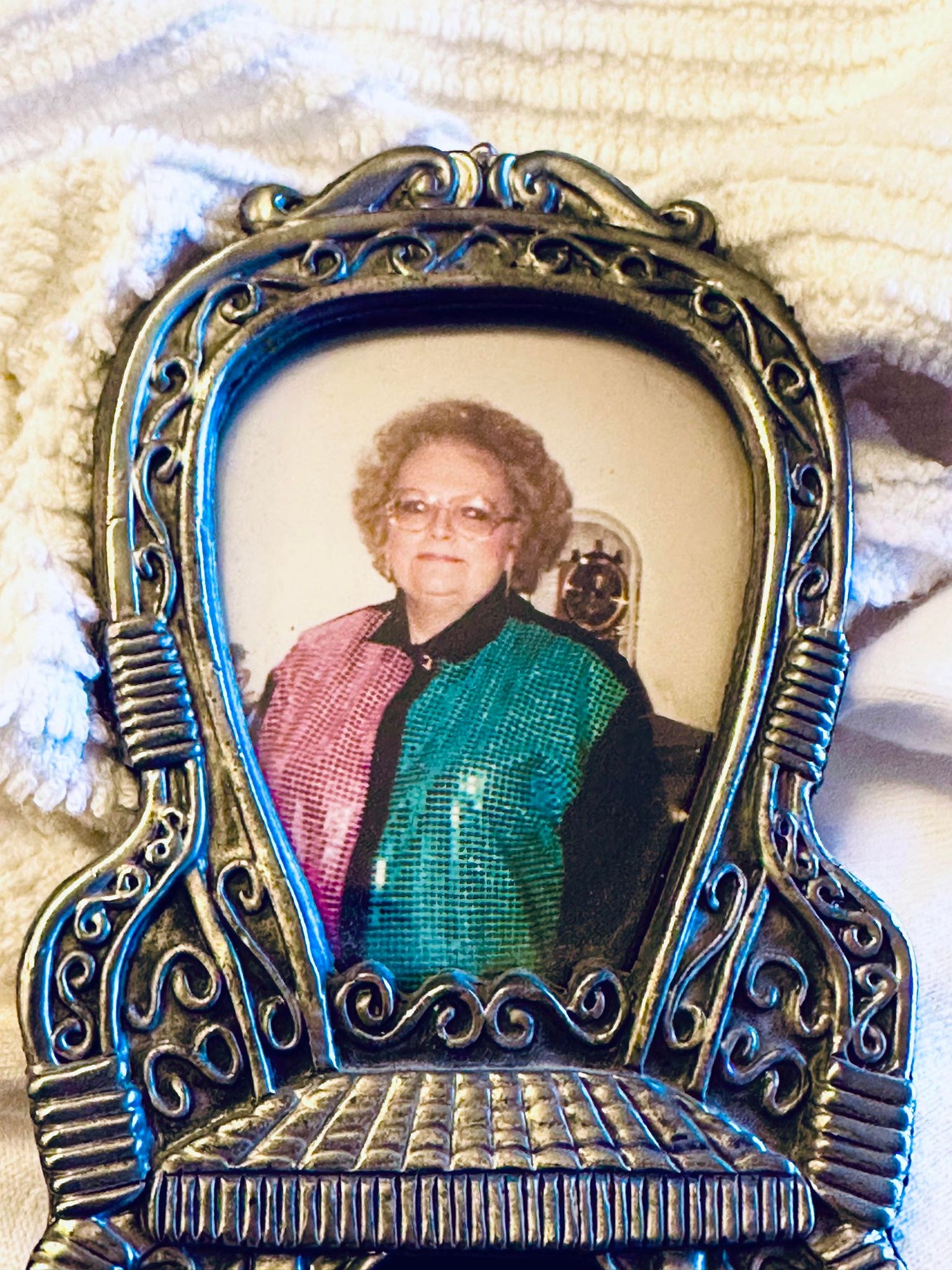 A picture in a frame of grandma Jane