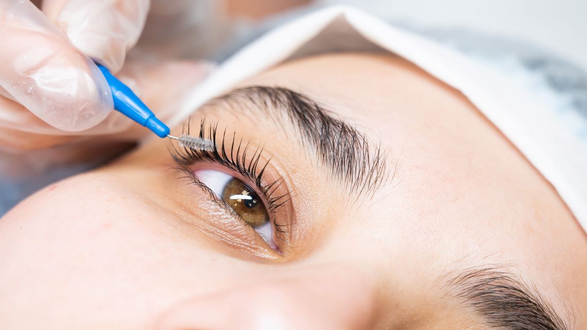 a woman getting an eyelash service preformed