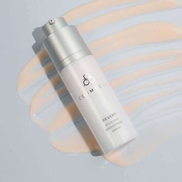 a bottle on it's side of Revert it is a Boosting Brightening Serum that helps to reduce the appearance of age spots and skin blotches