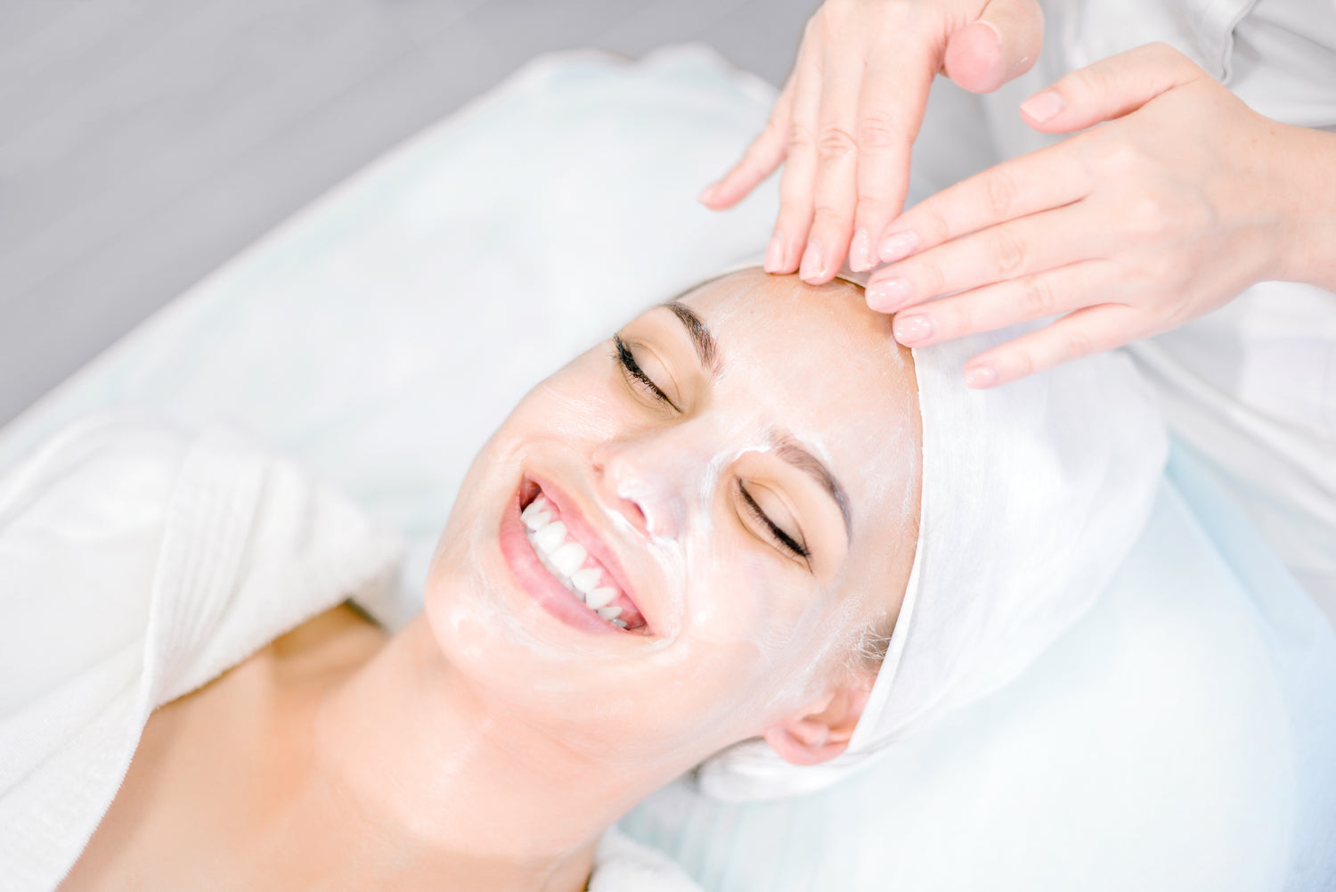 A woman getting a facial done